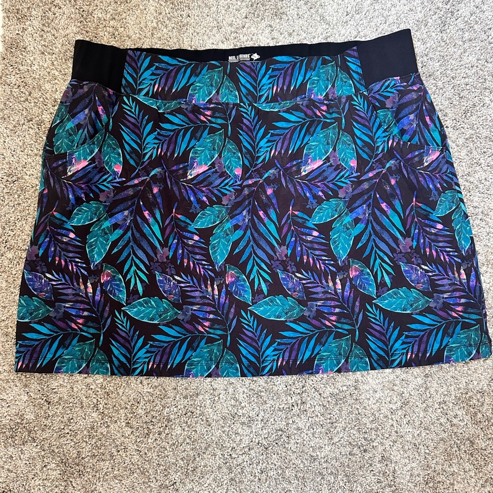 2 Reel legends swim/ active wear short skirts. One is blue and purple one is B&W